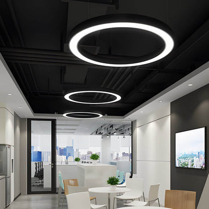 LED ring pendant light with white acrylic shade in an office