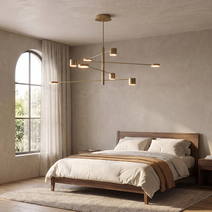 Lynx modern chandelier in metallic gold in a serene walnut bedroom