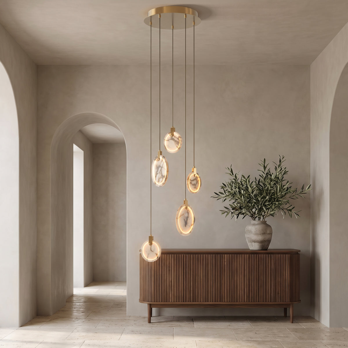 Marble cascading chandelier in an elegant entry hall