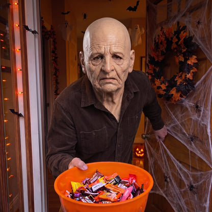 Deep-Wrinkle Elder latex mask worn at a Halloween front door