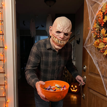 Long-Tooth Monster latex mask worn at a Halloween front door