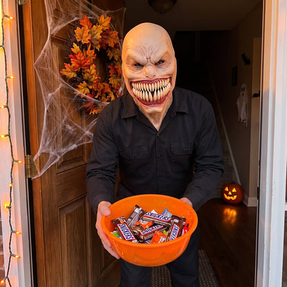 Fanged Monster II latex mask worn at a Halloween front door