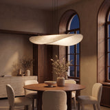 Kinu silk pendant light at night — lights on