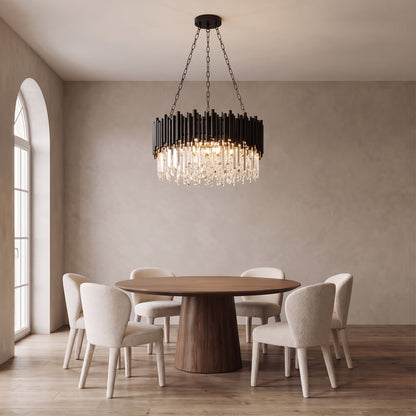 Noctis black crystal chandelier above a round walnut dining table