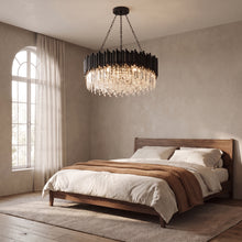 Noctis black crystal drum chandelier above a walnut bed