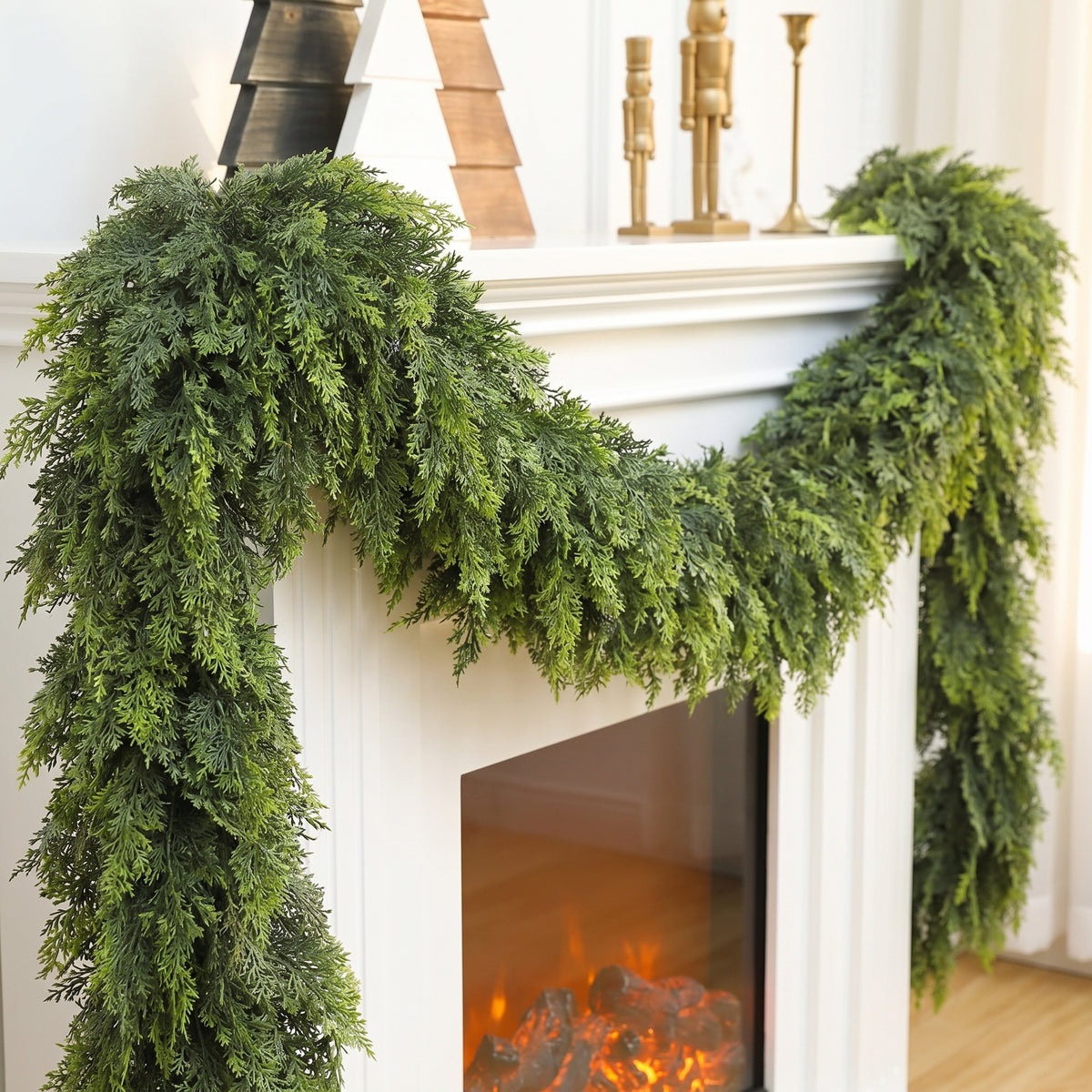 Noel Faux Cedar Pine Garland on fireplace mantel