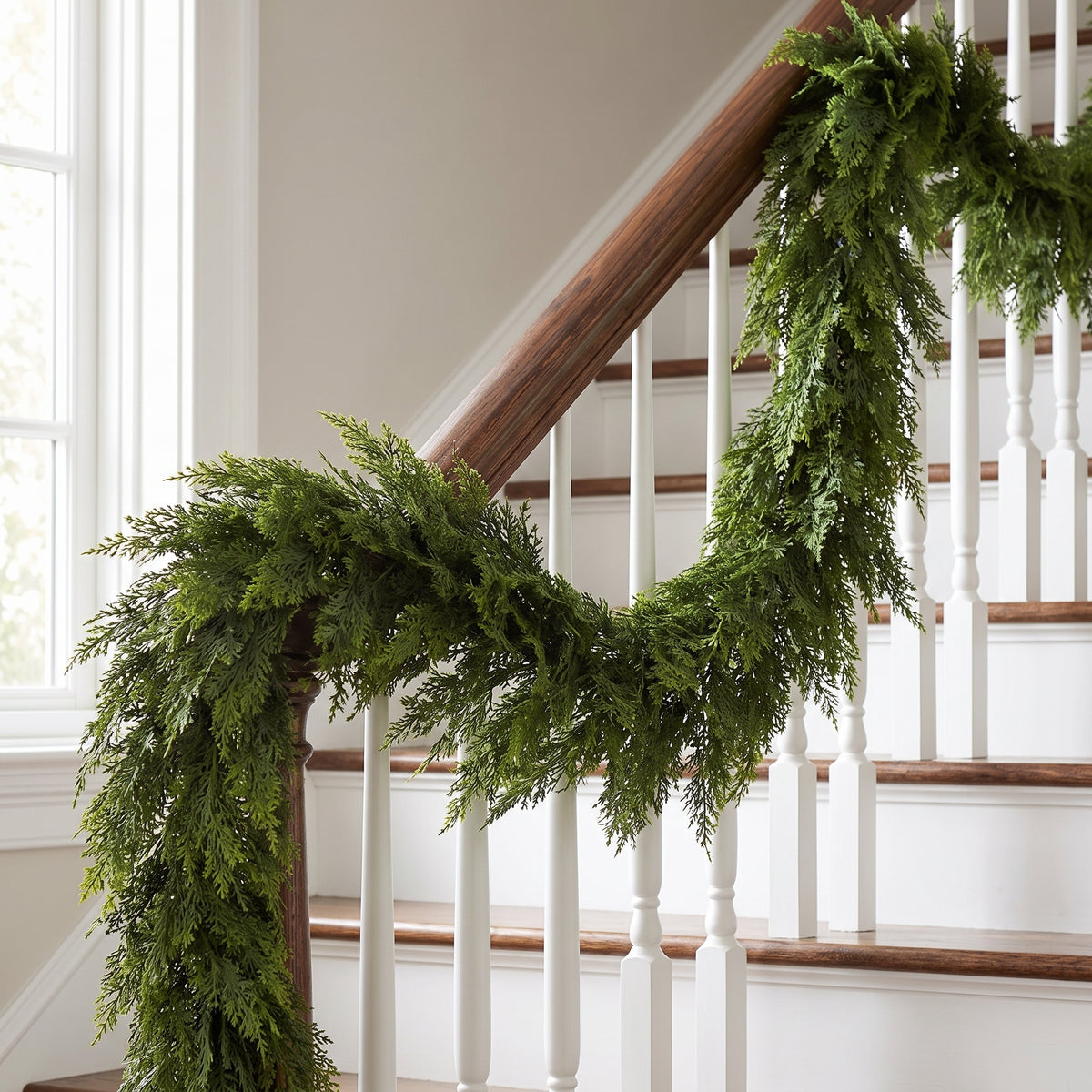 Noel Faux Cedar Pine Garland on staircase railing