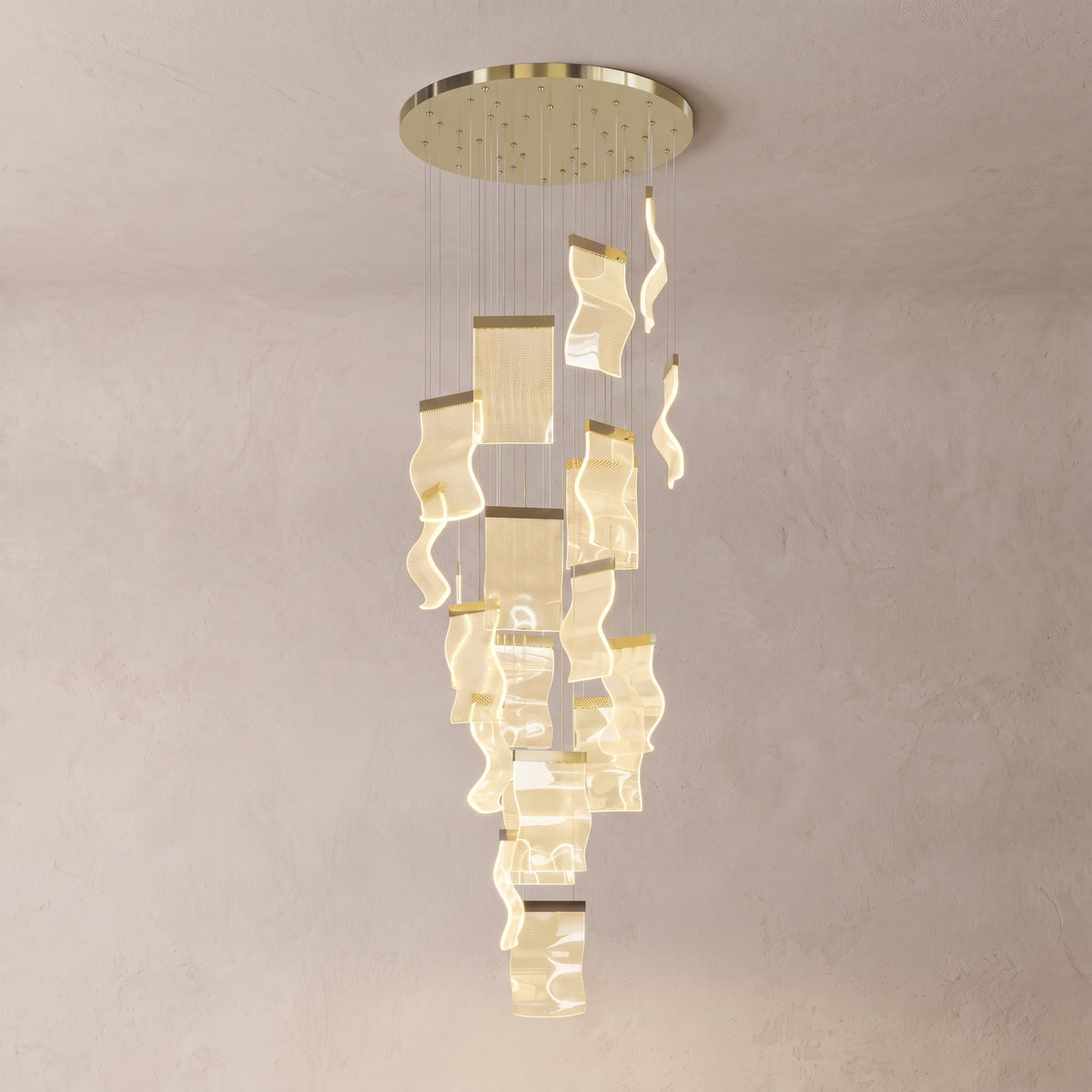 Nyra cascading chandelier on a warm light grey studio background