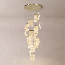 Nyra cascading chandelier on a warm light grey studio background