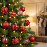 red ornaments hanging in a Christmas tree