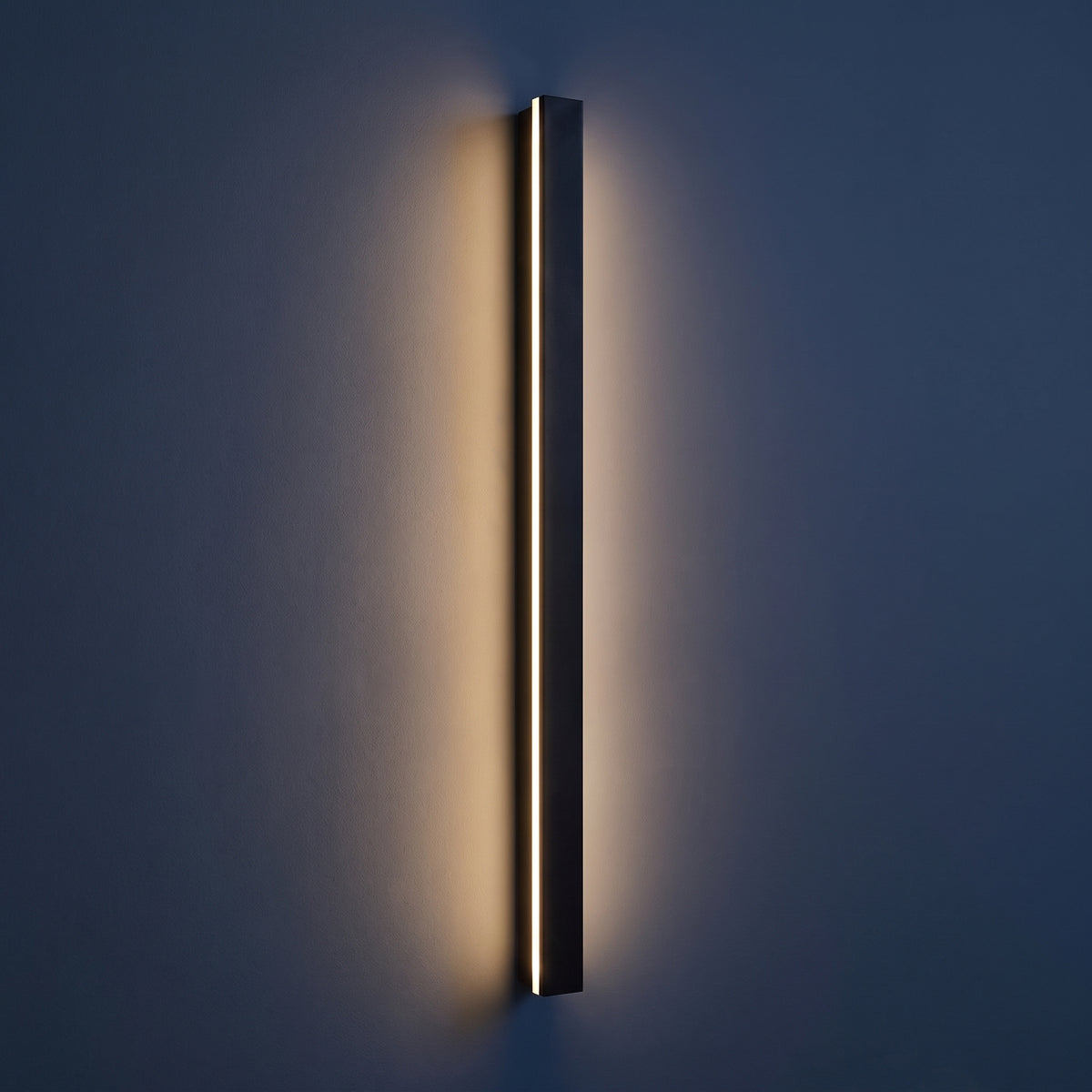 Marlow outdoor wall light at night — lights on