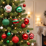 Red, green and white ornaments hanging in a Christmas tree