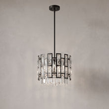 Raven mini black crystal pendant on a warm light grey studio background