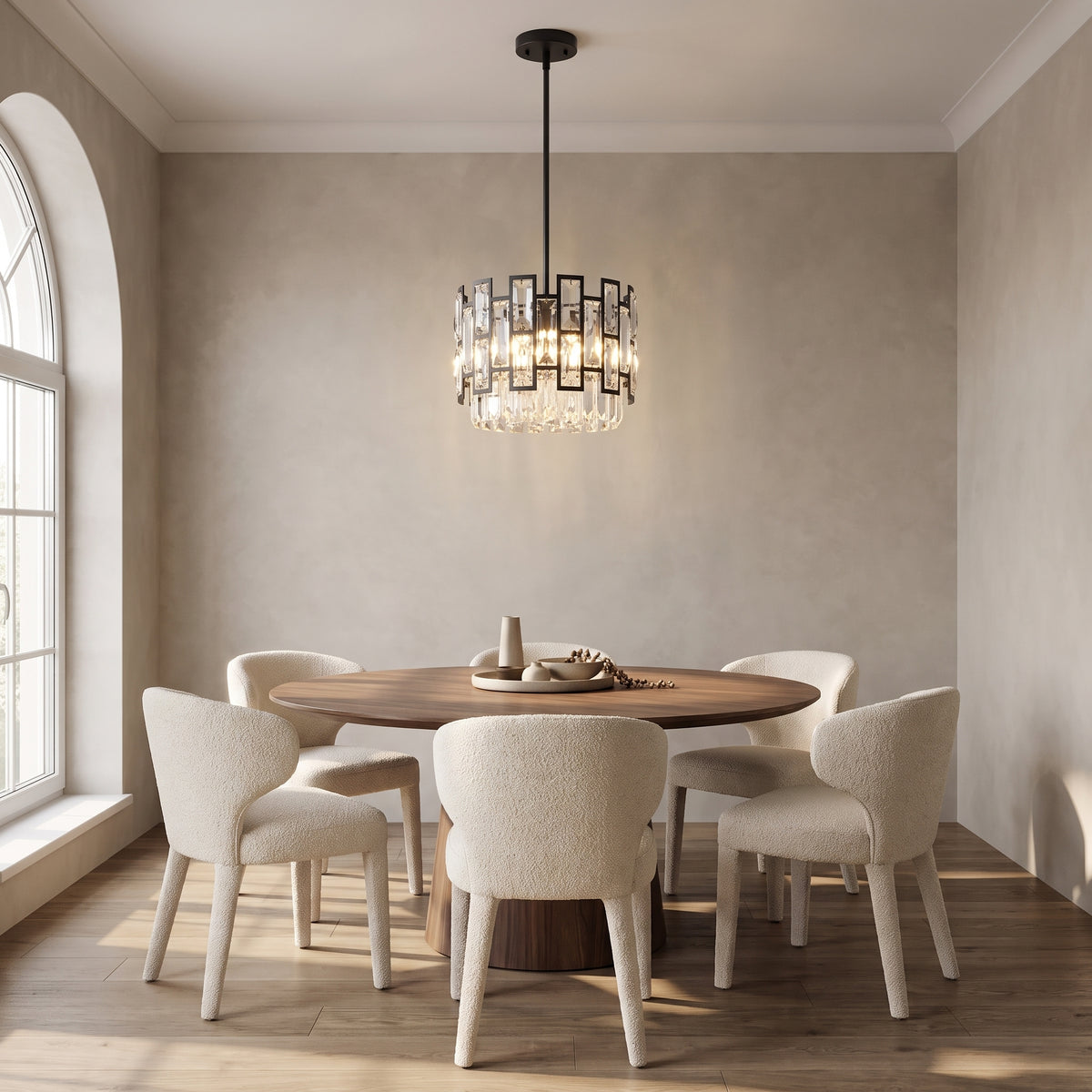 Raven mini crystal pendant above a round walnut dining table