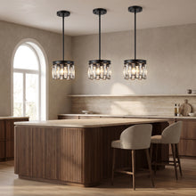 Three Raven mini black crystal pendants above a walnut kitchen island