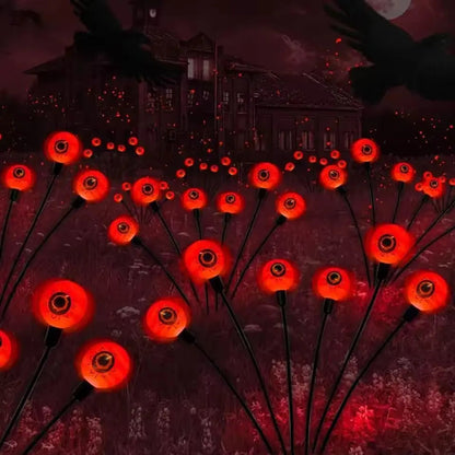 Close-up of a single glowing eyeball light stake