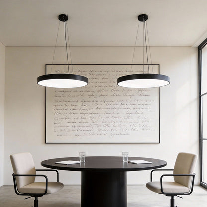 Round pendant light mounted above a coffee shop counter