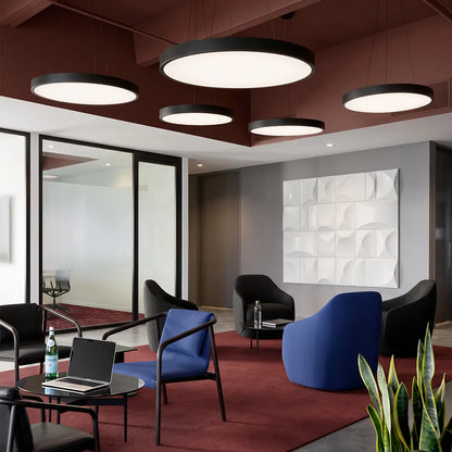 Round pendant light with floating ring design in an office