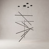 Rowan linear chandelier with 9 light bars on a warm light grey studio background