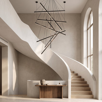 Rowan black linear chandelier with crisscrossing light bars in a stairwell