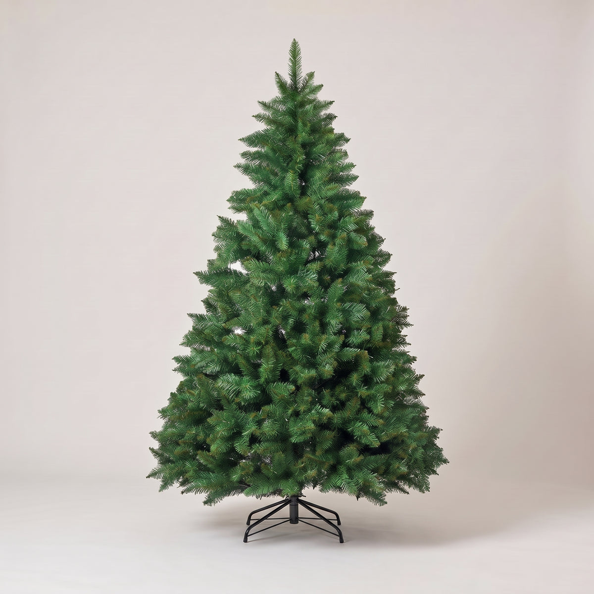 Green artificial Christmas tree, studio photo