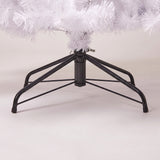 Close-up of the black folding metal tree stand of the white tree