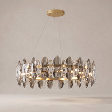 Seren smoky grey crystal chandelier on a warm light grey studio background