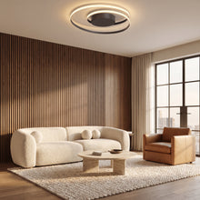 Linnea black ash spiral LED ceiling light in a living room with a walnut slat wall
