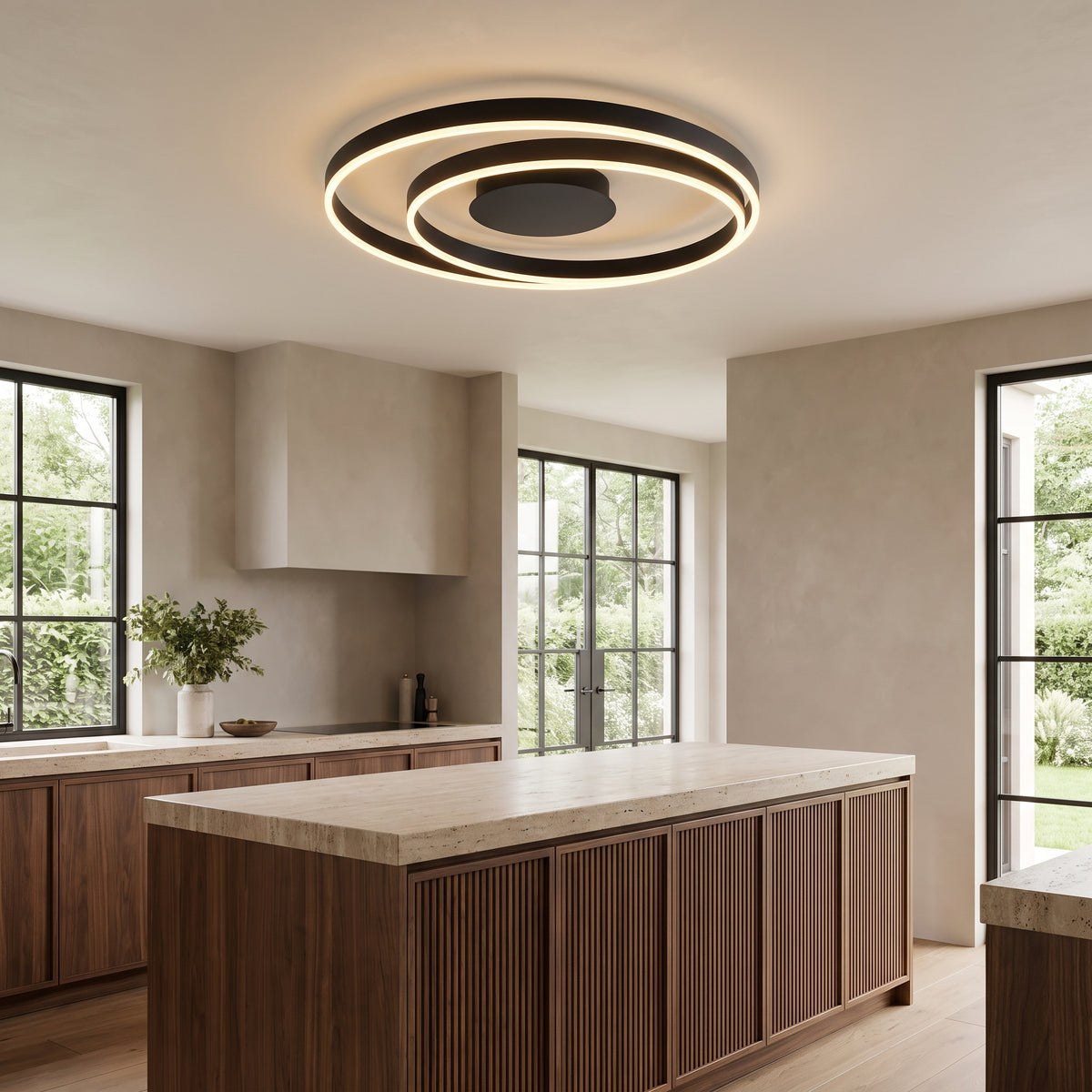 Linnea spiral LED ceiling light above a walnut kitchen island