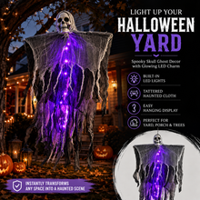 Hanging ghost decoration with a plastic skull under a tattered gauze shroud