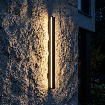 Sumi - mounted on stone wall at night