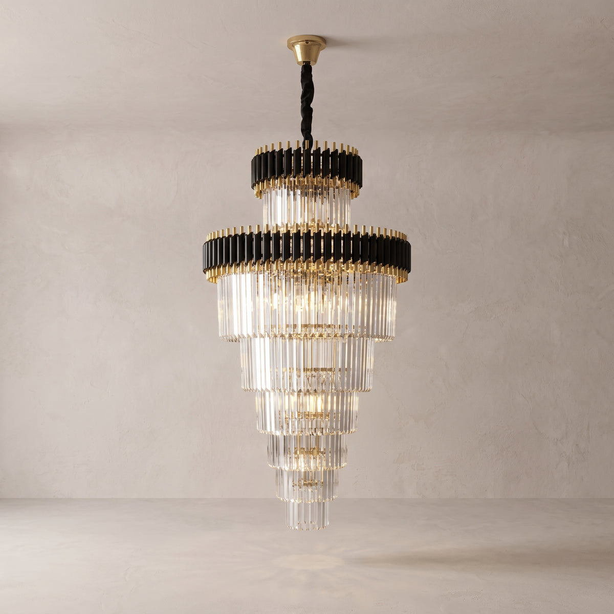 Vesper spiral crystal chandelier on a warm light grey studio background