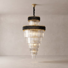 Vesper spiral crystal chandelier on a warm light grey studio background