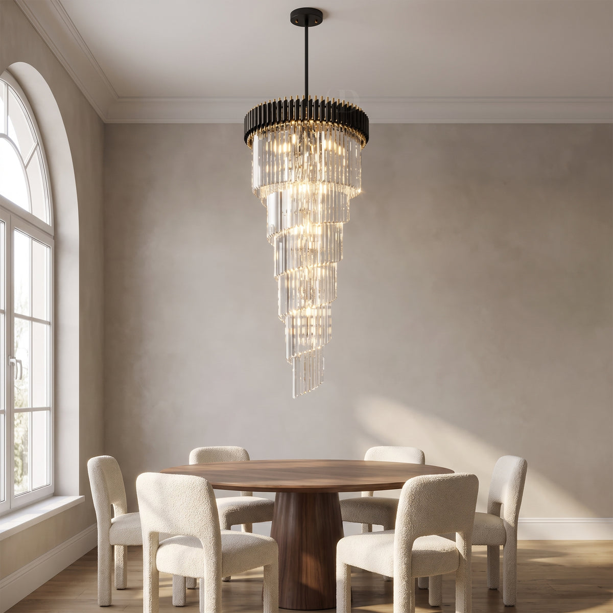 Vesper spiral crystal chandelier above a round walnut dining table