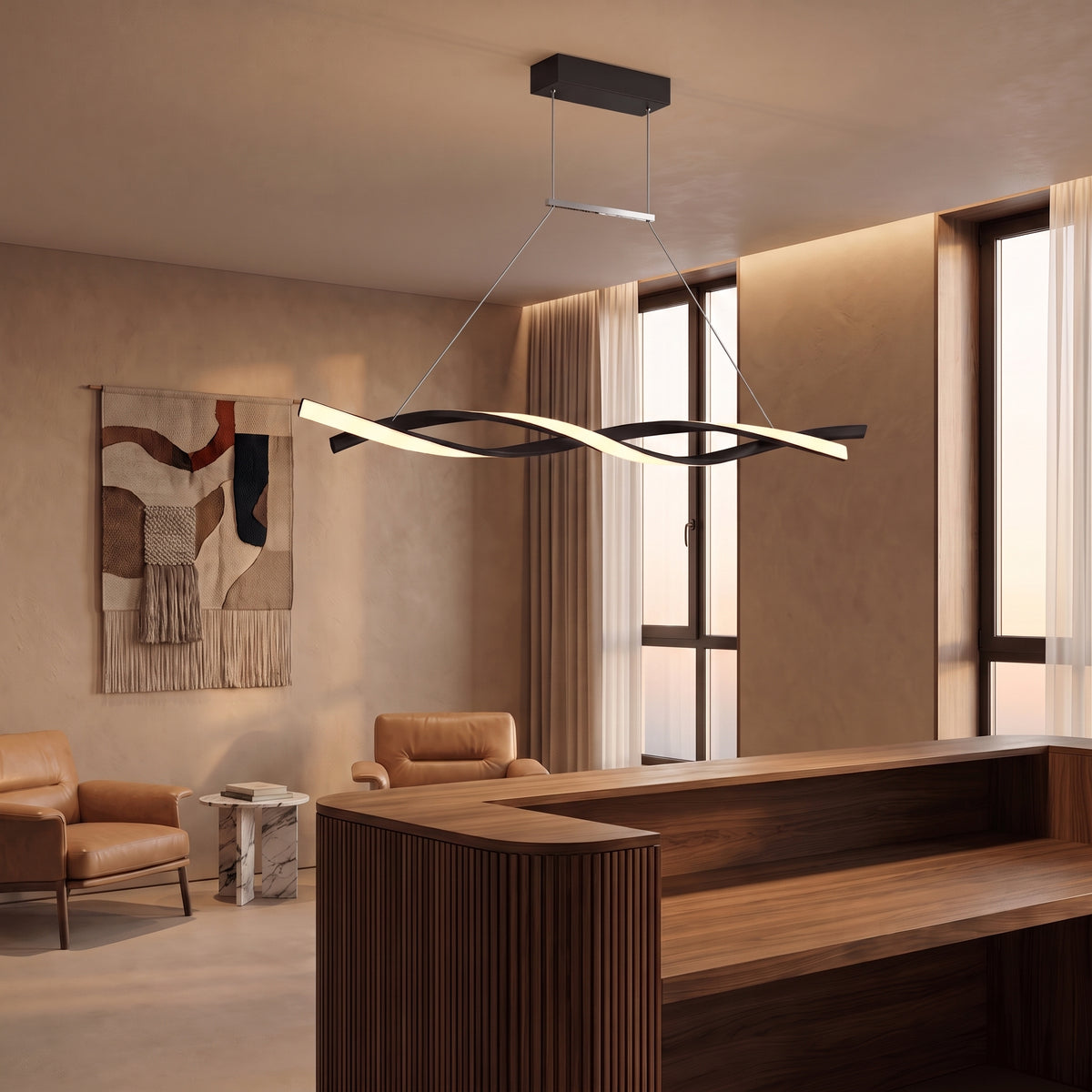 Ondine linear wave LED pendant above a boutique hotel reception desk