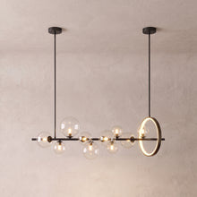 Wren linear glass globe chandelier on a warm light grey studio background